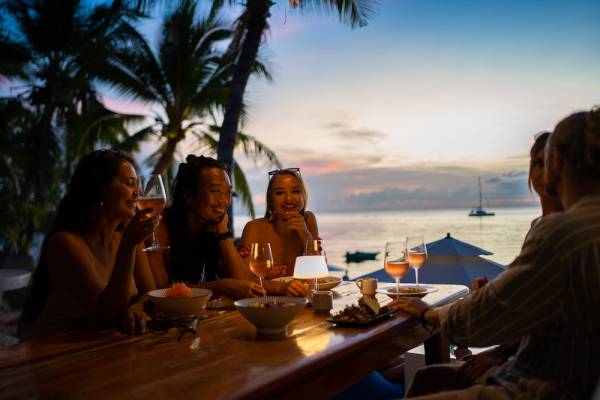 friends out to dinner at oceanfront restaurant