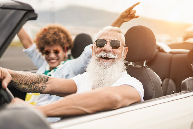 man and women in convertible car
