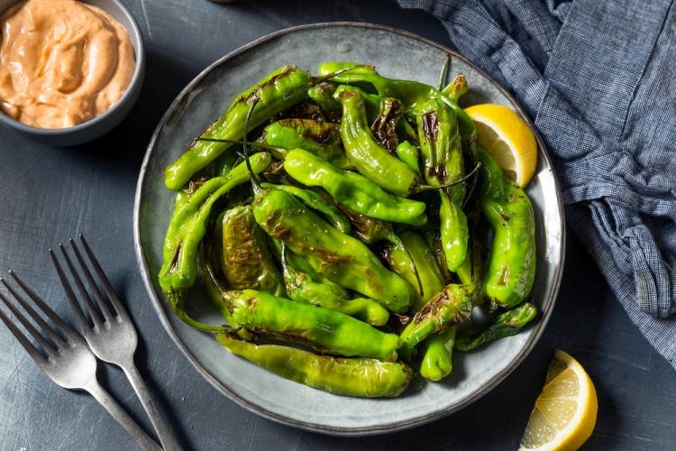 Blistered Shishito peppers in a bowl