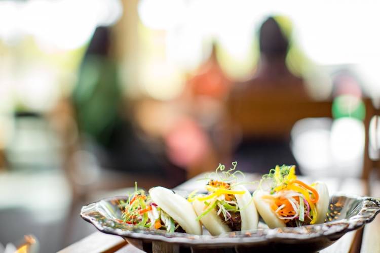three bao buns on a plate