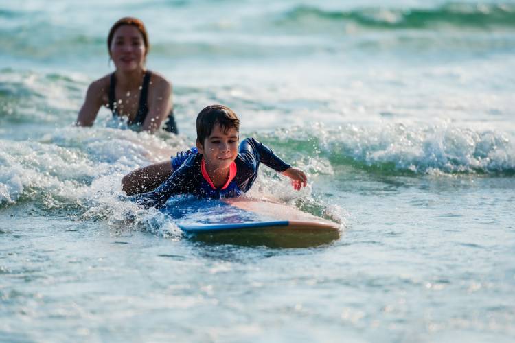 little kid in surf lesson