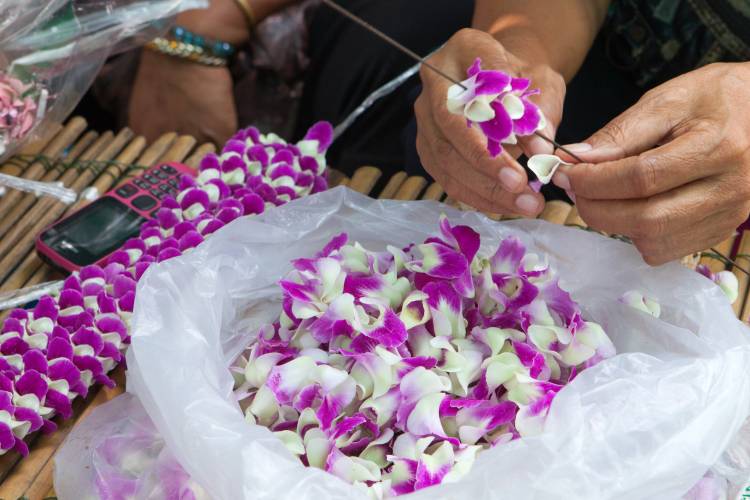 Woman making lei