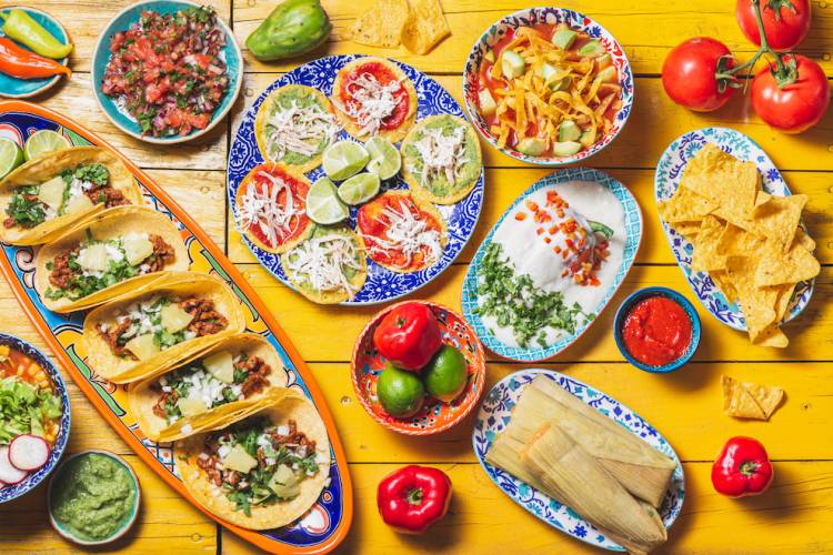 aerial view of table spread with mexican food dishes